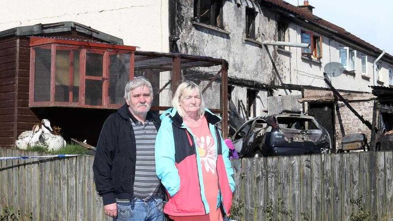 Cecil and Barbara Williamson outside their home in Richhill that was destroyed in an arson attack. Picture by Mal McCann 