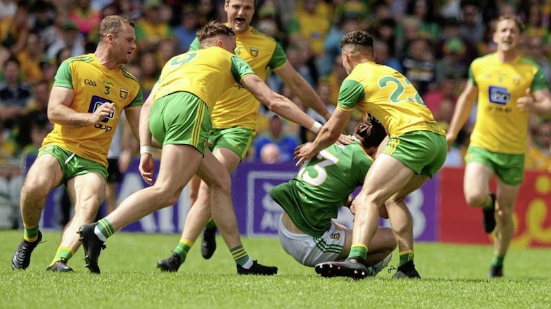 Cillian O&#39;Sullivan of Meath, is put under pressure by Donegal&#39;s Neil McGee, Jason McGee, Michael Murphy and Odhran Mc Fadden Ferry. Picture by Michael O Donnell. 
