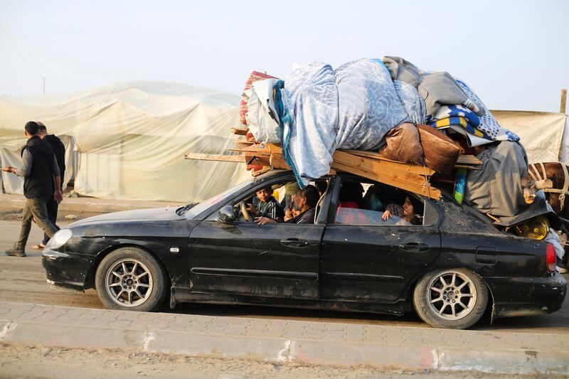 Palestinians fleeing the Israeli bombardment of the Gaza Strip arrive in Rafah (AP)