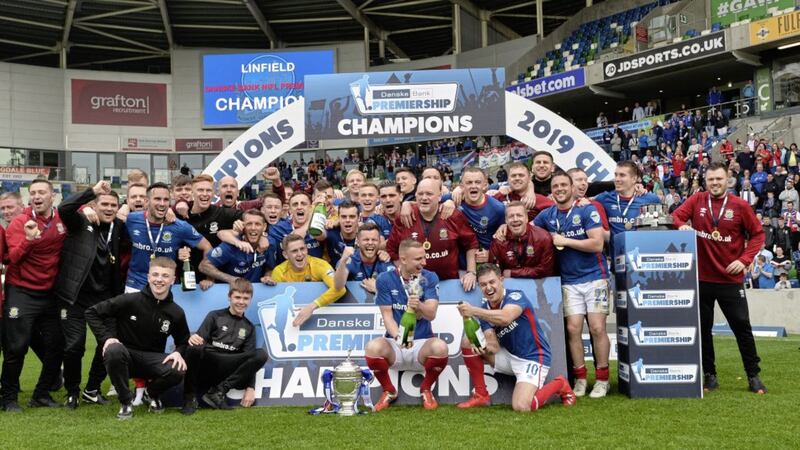 Linfield players and officials celebrate lifting the Gibson Cup  as they are presented with their 53rd Premiership title after the game at Windsor Park in Belfast on April 20 2019. Picture by Colm Lenaghan/Pacemaker Press.