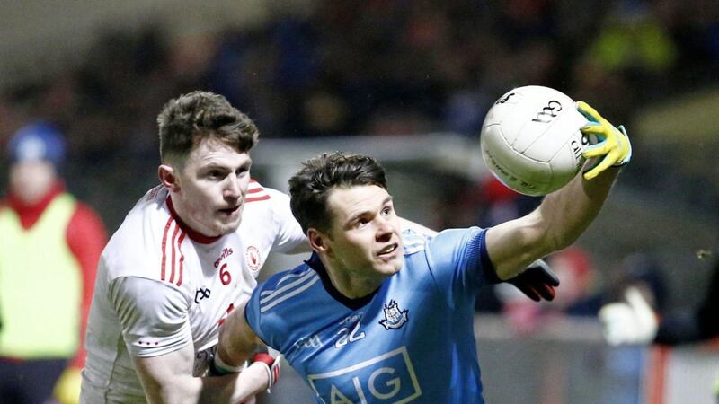 Tyrone goalscorer Rory Brennan chases Dublin&rsquo;s Kevin McManamon, who had his side&#39;s late chance to peg Tyrone back. Picture by Philip Walsh 