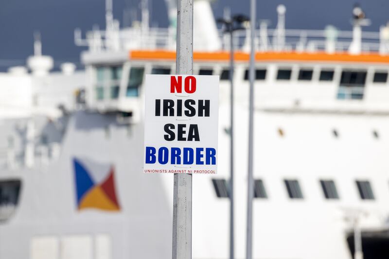 A sign on a lamp post outside Larne Port with the word No Irish Sea Border