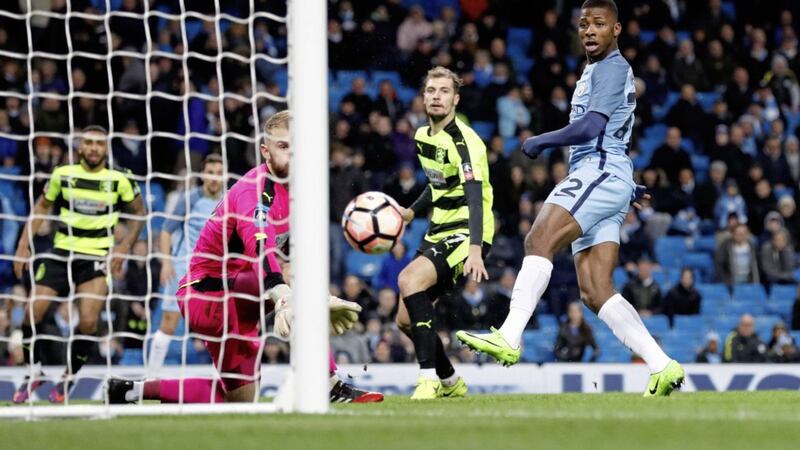 Manchester City&#39;s Kelechi Iheanacho scores his side&#39;s fifth goal of the game during the 5-1 win over Huddersfield Town in the Emirates FA Cup  fifth round replay at the Etihad Stadium last night Picture by PA 