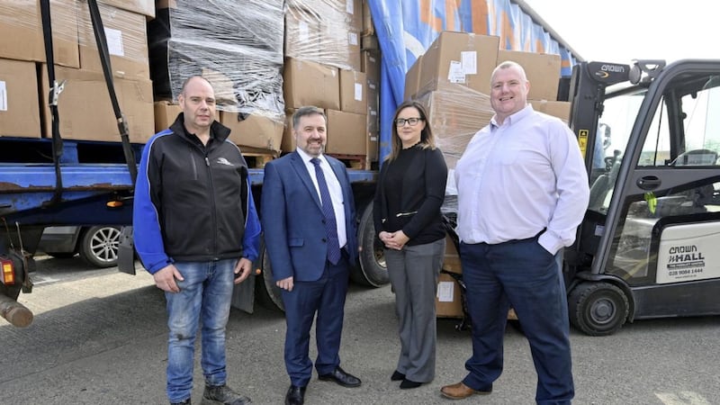 Health Minister Robin Swann pictured with the latest consignment of humanitarian aid which is being donated to Ukraine by the Department of Health. Mr Swann is pictured with (L-R) Joe Coyle, from Hope 365, Monica Turkington, BSO Quality Improvement &amp; Customer Liaison Manager, and David McCavana, BSO Senior Logistics Manager 