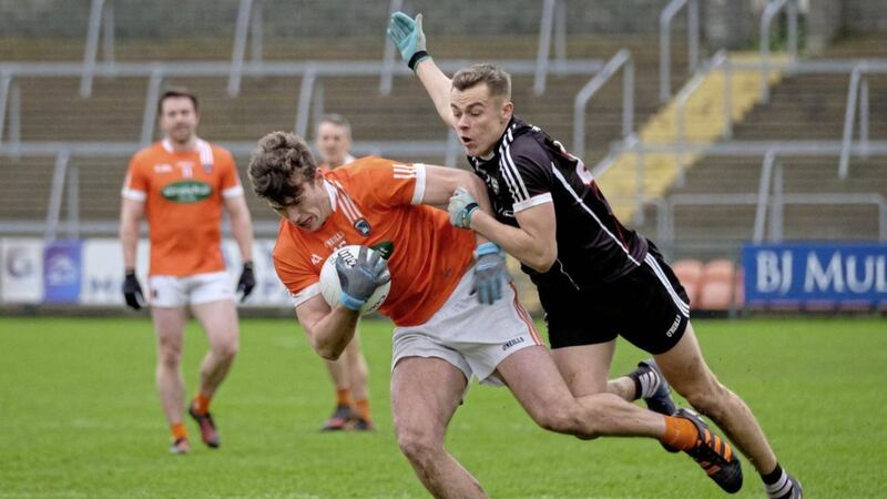 Armagh&#39;s Ethan Rafferty is closely marked by Sligo&#39;s Luke Nicholson at the Athletic Grounds. Rafferty bagged 1-3 from play as Armagh get off to a winning start in Division Three 