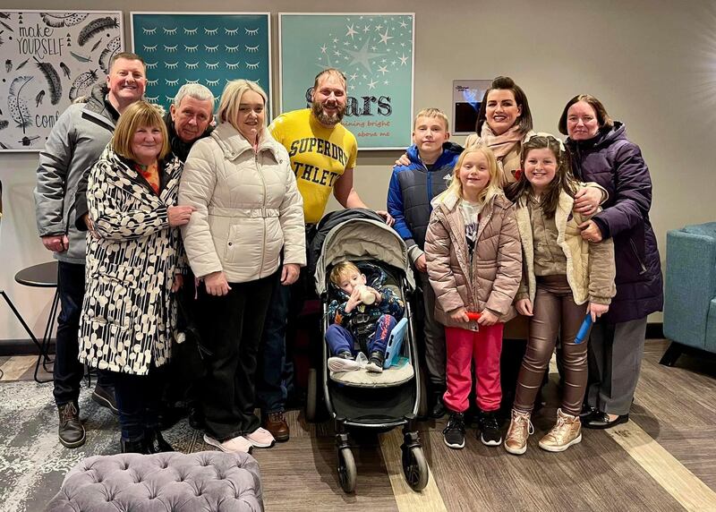 Allan McPike (left) with Sam Brand (fourth from left) with their families in Edinburgh in November. Allan donated bone marrow which saved the life of Sam’s son Ryan (fourth from right) five years ago.