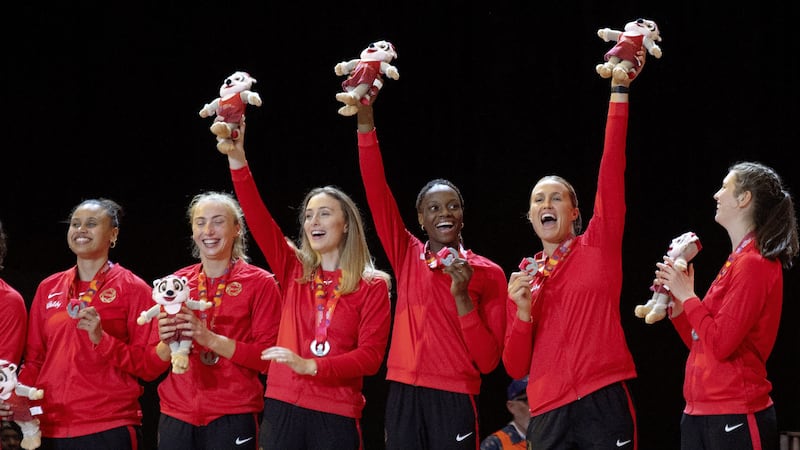 England players with silver medals after the 2023 Netball World Cup final at the Cape Town International Convention Centre (PA)