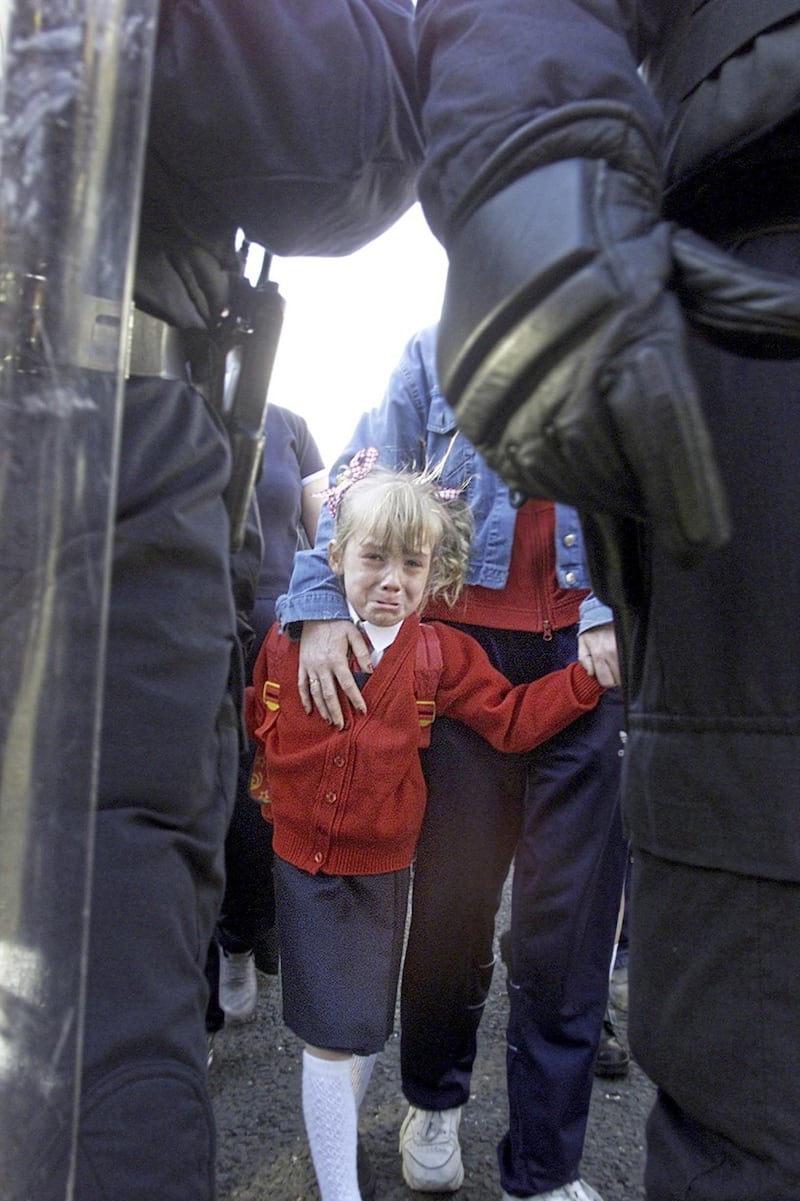 A young girl during the Holy Cross dispute in Ardoyne, north Belfast, in 2001. Picture by Hugh Russell 