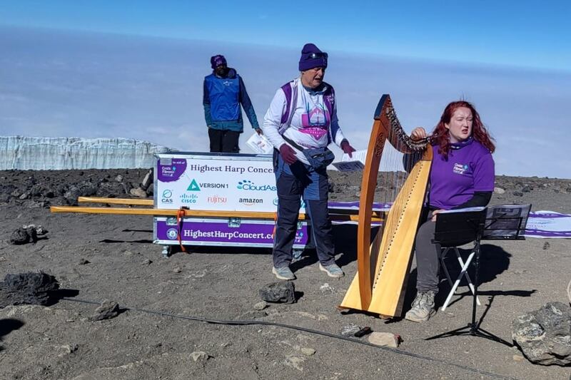 Harpist Siobhan Brady performing on Mount Kilimanjaro