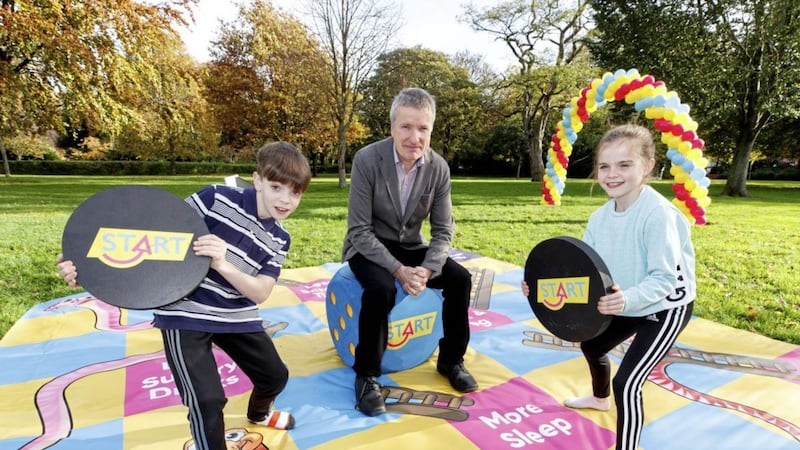 Dr John Sharry pictured with the children from the new Start TV ad, Jack (12) and Hannah Galvin (9) 