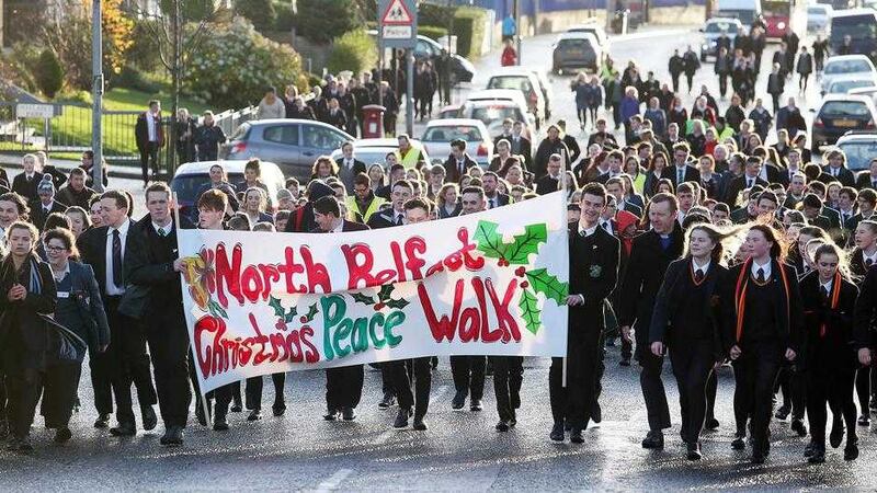 Pupils from seven schools take part in a Christmas peace walk around north Belfast