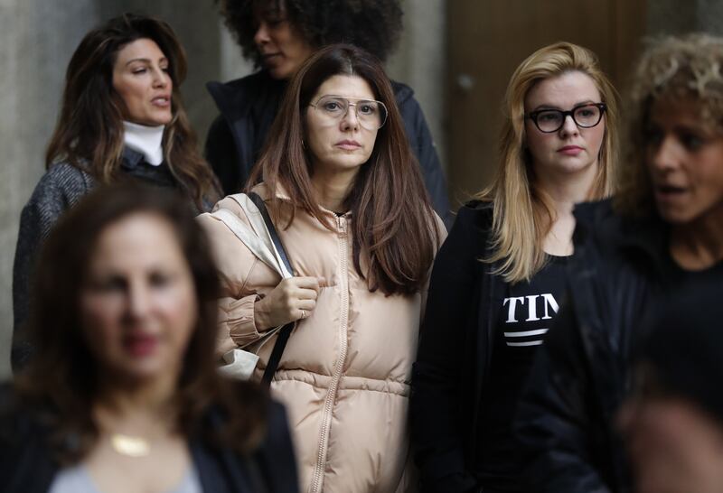 Marisa Tomei, centre, leaves New York Supreme Court 