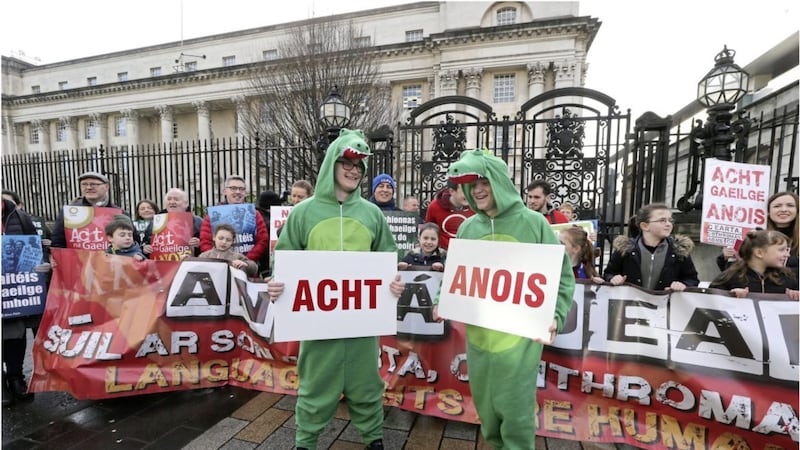 Irish language activists take part in a protest outside Belfast High Court yesterday. Picture by Hugh Russell. 