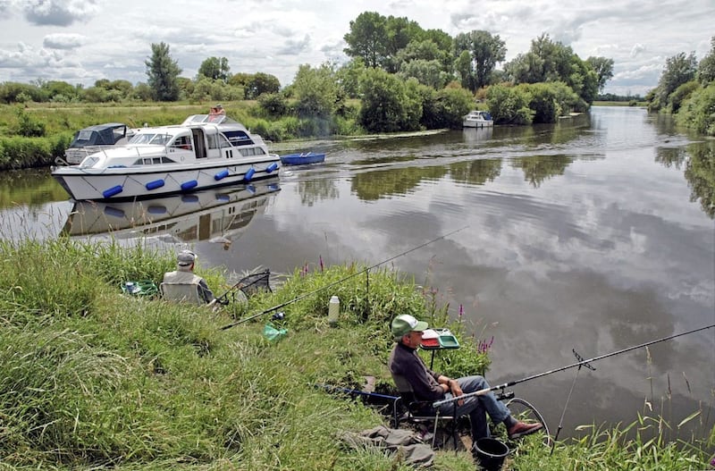 Holidaymakers cruise past fishermen on the Shannon and Erne waterways 