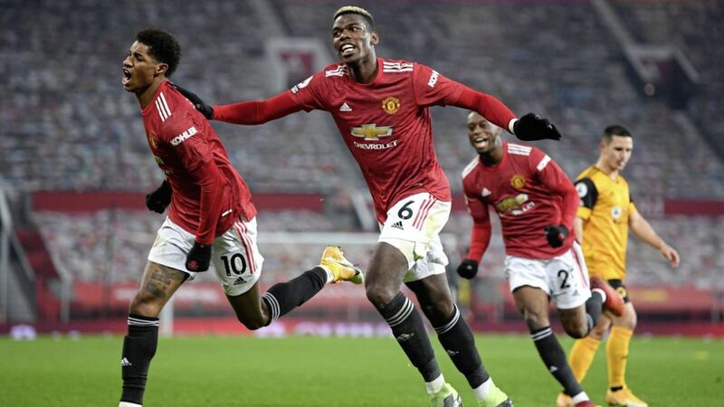 Manchester United&#39;s Marcus Rashford (left) celebrates scoring his side&#39;s first goal of the game during the Premier League match at Old Trafford, Manchester on Tuesday December 29, 2020. Picture by Michael Regan/PA. 