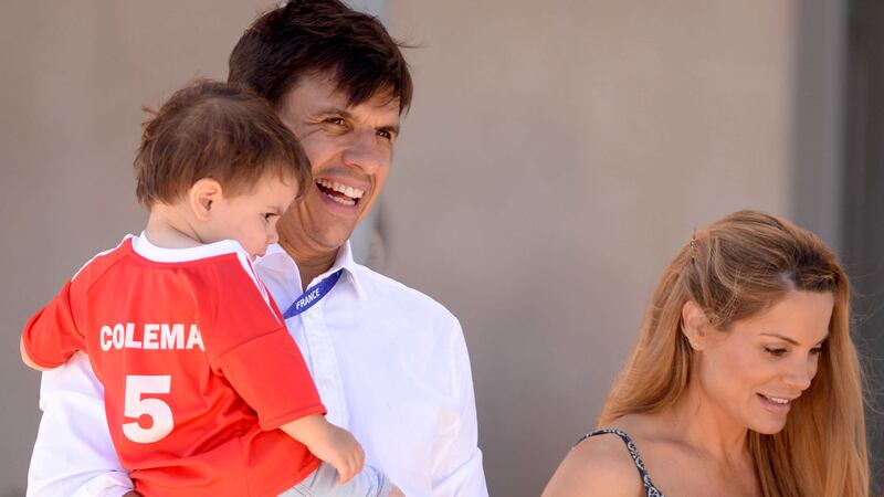 Wales manager Chris Coleman with his son Finley and wife Charlotte Jackson at the Golden Tulip hotel in Lyon on Thursday<br />Picture by AP