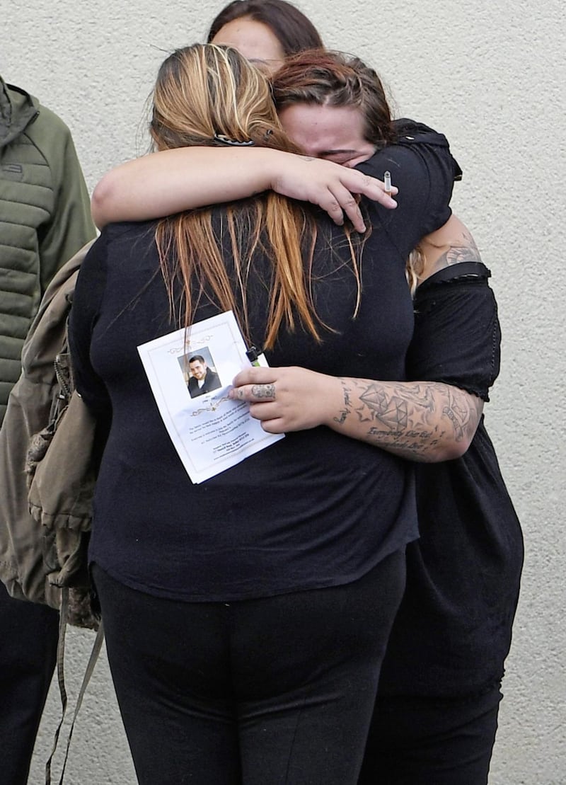 &nbsp;<span style="font-family: Arial, sans-serif; ">Dean McIlwaine's family and frineds comfort each other at funeral in Carnmoney.&nbsp;Picture by Justin Kernoghan.</span>