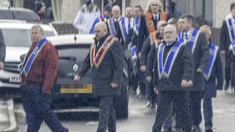 Lisburn DUP councillor Paul Porter (left, red jacket) at Saturday&#39;s parade. Picture: Sunday Life 