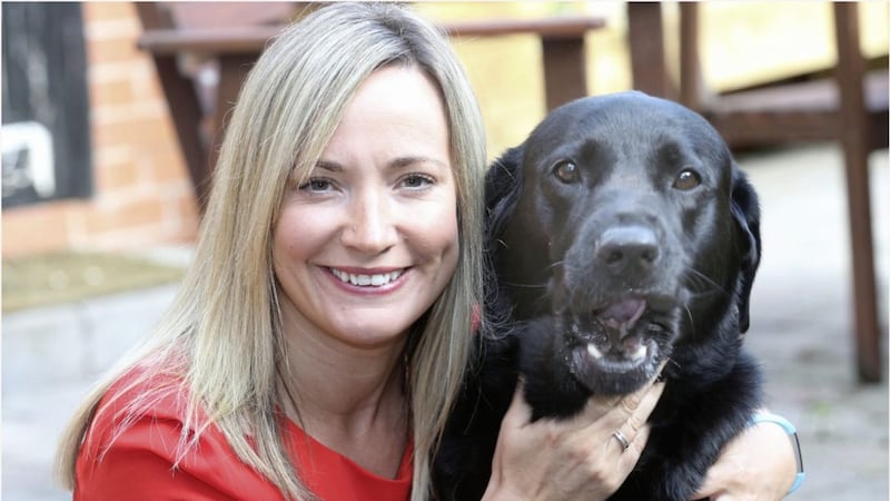 Belfast social worker Clayre Thompson with five-year-old black Labrador Ruby, who&#39;s known as Ruby the Wonderdog on Instagram Picture: Hugh Russell 