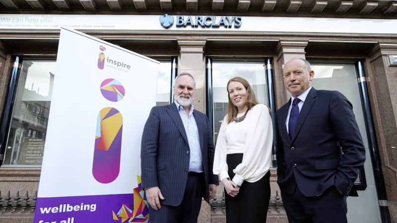 Sir Ian Cheshire, Barclays UK chairman, right, is pictured with Peter McBride, chief executive of Inspire Wellbeing and Joanna McArdle, Barclays relationship director. The bank has raised &pound;10,000 for Inspire in 2017. 