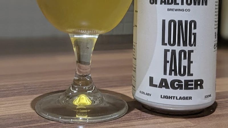 Spade Town&#39;s Long Face lager pours a golden colour with a generous fluffy white head 
