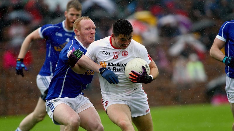 Tyrone's Ronan O'Neill is put under pressure by Cavan's Cian Mackey during last Sunday's Ulster SFC semi-final at Clones <br />Picture by Seamus Loughran&nbsp;