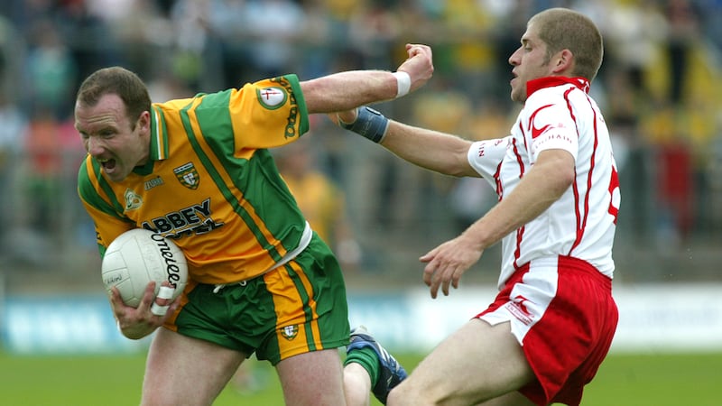 Tyrone's Kevin Hughes takes on Donegal's Adrian Sweeney during their 2007 Ulster SFC clash&nbsp;