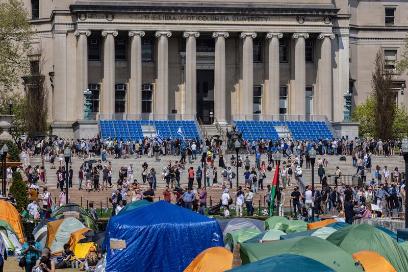Student protesters march around their encampment at Columbia University (Stefan Jeremiah/AP)