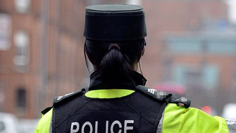 A female police officer suffered a double leg fracture in an attack at a Belfast police station 
