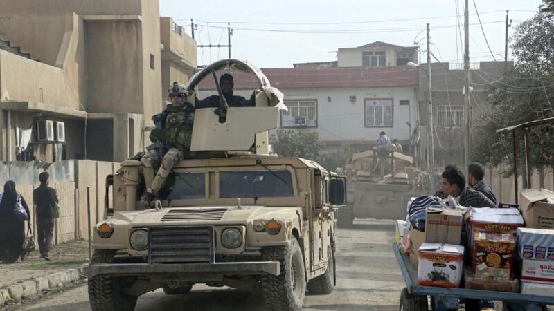 Iraqi security forces patrol in the eastern side of Mosul Picture by Khalid Mohammed/AP 