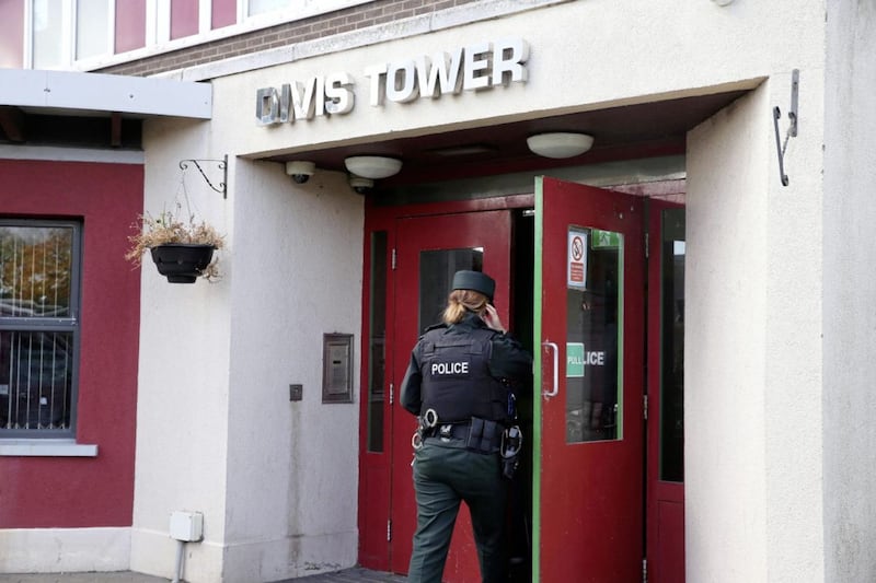 Police at the scene at Divis Tower in west Belfast where Jim Hughes (62) was found dead in his flat Picture Mal McCann. 
