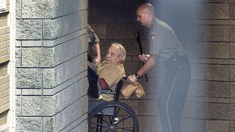 Robert Gentile is brought into Connecticut courthouse in a wheelchair in 2005 