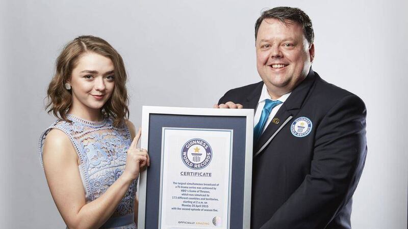 Game of Thrones actress Maisie Williams picking up an award on behalf of the show after it made the Guinness Book of Records for the largest TV drama simulcast. Picture Paul Michael Hughes/GWR/PA Wire.. 
