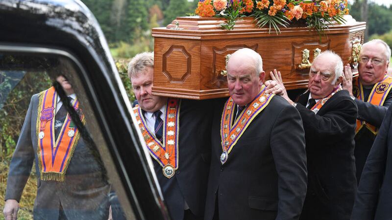 Orange Order Grand Master Edward Stevenson (right, front) and Deputy Grand Master Harold Henning helping to carry the coffin of Drew Nelson. Picture by Justin Kernoghan 