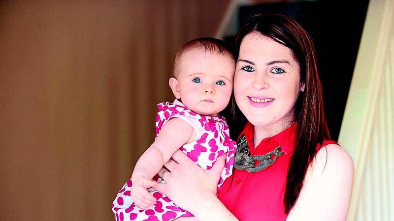 Nicola McNamee and her daughter Melissa Rose at her home in Lisnaskea. The Fermanagh woman successfully took a sex discrimination case against Melting Moments bakery who dismissed her after she become pregnant. Picture by Arthur Allison, Pacemaker&nbsp;