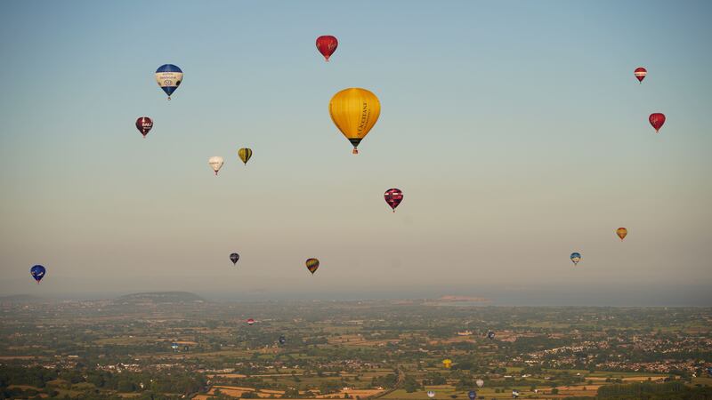 After wind grounded the first launch, the colourful extravaganza saw hot air balloons fill the sky.