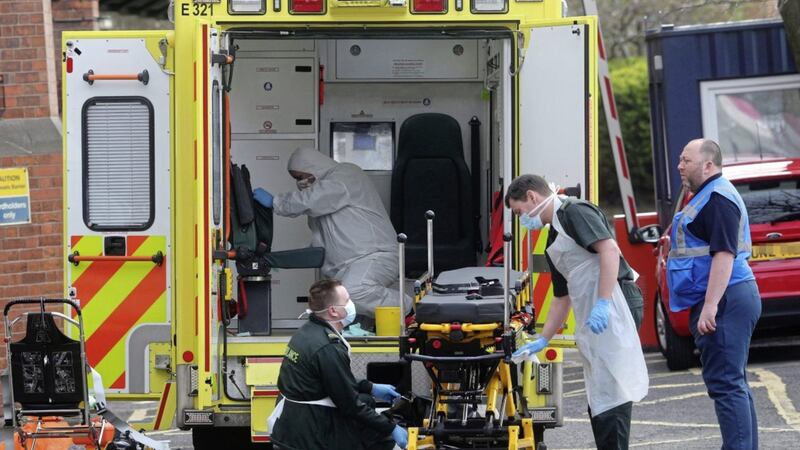 Ambulance staff clean one of their vehicles outside the Mater Hospital earlier this week. A paramedic who tested positive for Covid-19 has spoken anonymously to The Irish News. Picture by Mal McCann. 