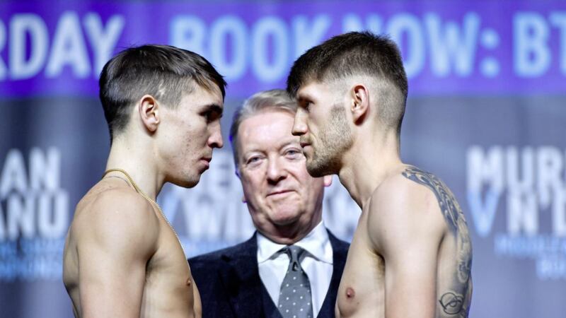 Michael Conlan (left) and Jason Cunningham during the weigh in at Manchester Central yesterday 