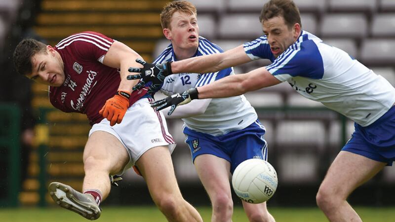 Galway's Damien Corner tries to get his shot away under pressure from Monaghan pair Ryan McAnespie and Conor Boyle during yesterday's Football League Division One match at Pearse Stadium&nbsp;