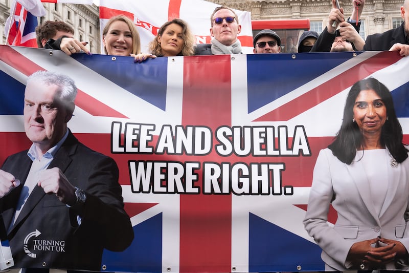 Fox posed with a banner that read ‘Lee (Anderson) and Suella (Braverman) were right’