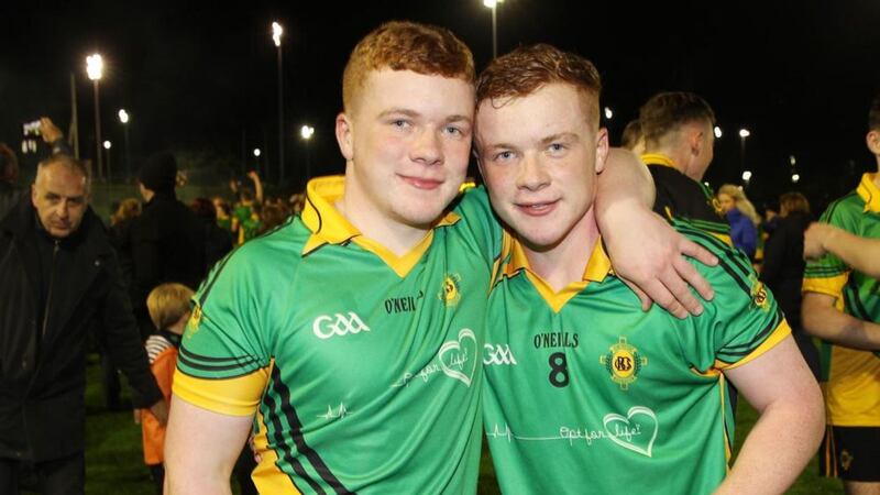St Mary's CBS player Odhr&aacute;n McKenna (left) with his twin brother CJ after the Belfast school's Mageean Cup triumph on Wednesday night <br />Picture by Philip Walsh