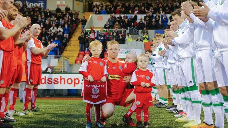 George McMullan with his children at his testimonial game against Celtic last month 