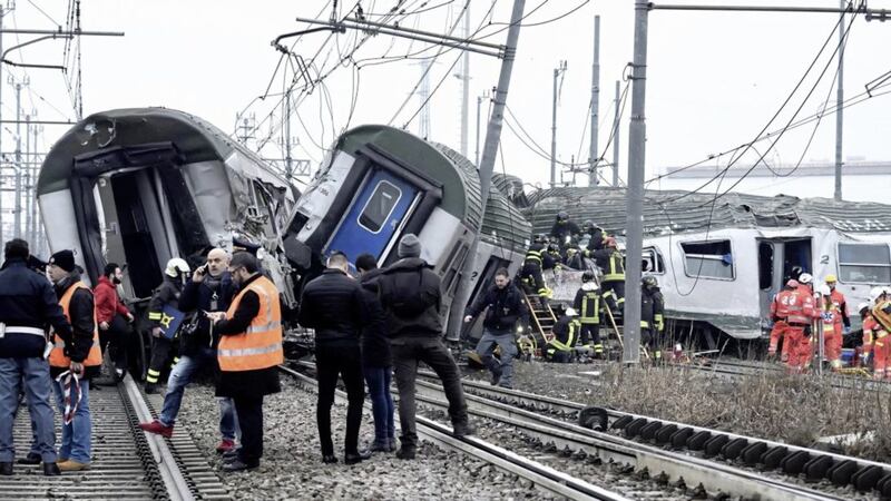 Rescue teams help passenger out of a derailed train at the station of Pioltello Limito, on the outskirts of Milan PICTURE: Flavio Loscalzo/ANSA via AP               