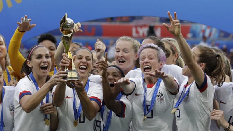 United States' team celebrates with trophy after winning the Women's World Cup final soccer match between US and The Netherlands at the Stade de Lyon in Decines, outside Lyon, France, Sunday, July 7, 2019. Pictute by&nbsp;AP Photo/Alessandra Tarantino