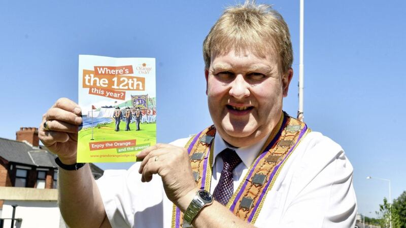Deputy Grand Master Harold Henning launching a leaflet on the Twelfth of July parades ahead of the Open golf tournament in Portrush 