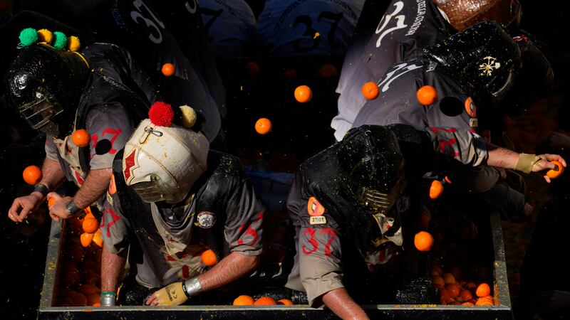 People attend the Battle of the Oranges (Antonio Calanni/AP)