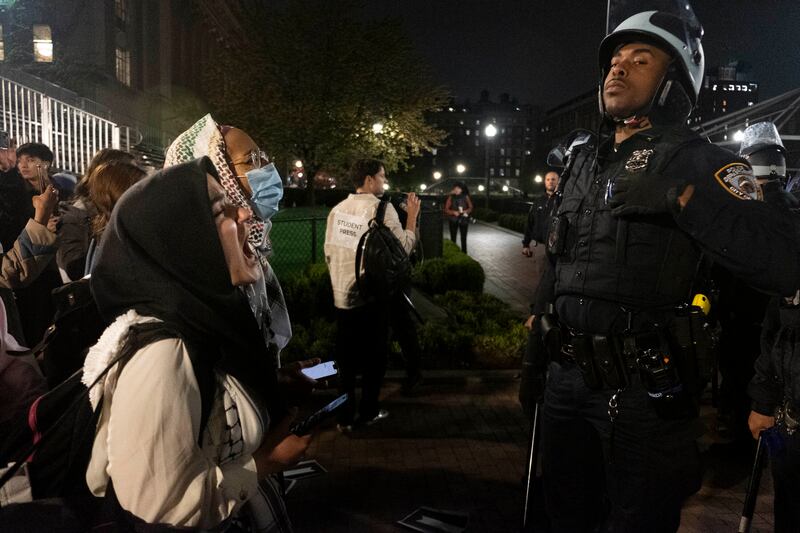 Pro-Palestine student activists face off with New York Police Department officers during a raid on Columbia University’s campus in New York (Seyma Bayram via AP)