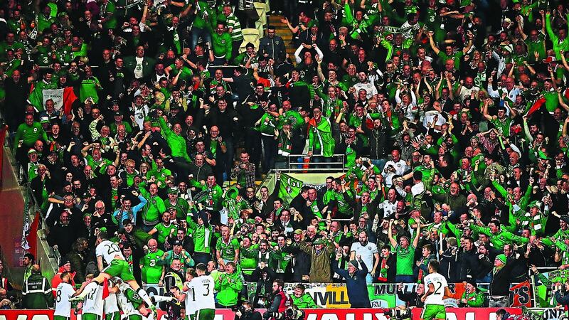 GREEN GIANTS: Republic of Ireland players and fans celebrate James McClean&rsquo;s winning goal against Wales in Cardiff on Monday night. The victory sealed a World Cup play-off place and once more proved that for all his failings, Irish boss Martin O&rsquo;Neill has the Midas touch						 Picture: PA  &nbsp;
