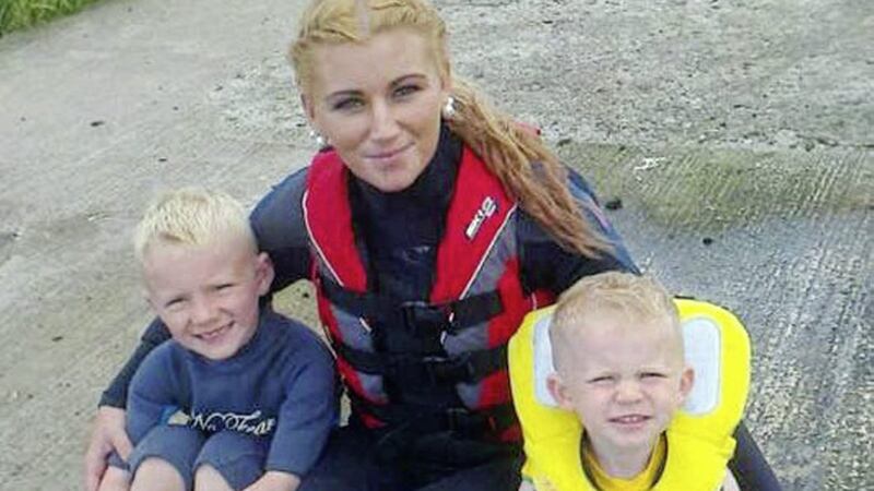 West Belfast mother Louise McIlwane, who died suddenly in January, pictured with her young children Tom and Martin 