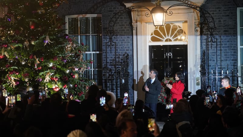 Prime Minister Rishi Sunak and his wife Akshata Murty, at the switching on of the Downing Street Christmas tree lights in London (Victoria Jones/PA)